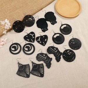 Set of 8 pairs of black hollowed wooden earrings with African map and geometric patterns