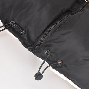 Detailed macro view of high-quality black zipper and adjustable drawstring hardware on jacket