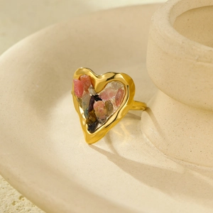 Close-up of 18K gold heart ring inlaid with colorful natural crushed tourmaline stones