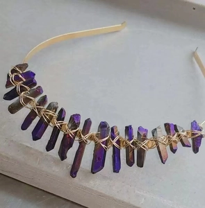 Detail of natural purple crystal pillars hand-wrapped on a golden bridal tiara crown