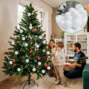 Family decorating a Christmas tree with white snowball ornaments in a cozy home setting