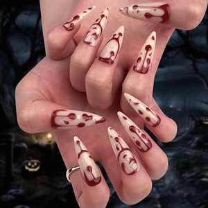Halloween long stiletto press-on nails with red blood drips and spooky ghostface patterns
