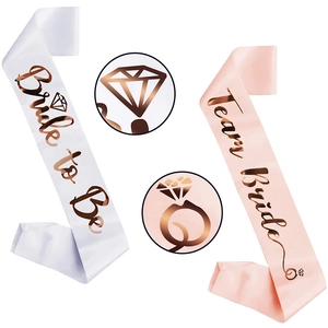 White Bride to Be and pink Team Bride satin sashes with rose gold lettering for parties