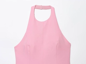 Close-up of pink halter neckline detail with fine textured fabric and minimalist finish