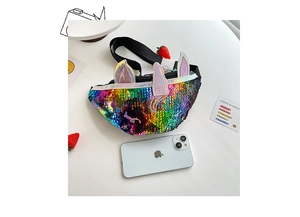Macro detail of sequin unicorn waist bag featuring 3D ears and strawberry charm