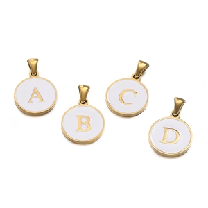 Macro detail of round stainless steel enamel letter charms A B C D with gold frames