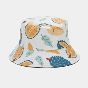 Detail of white cotton bucket hat featuring all-over cartoon durian and leaf print