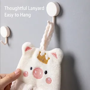 Absorbent white coral fleece hand towel with cartoon pig design and gold crown embroidery