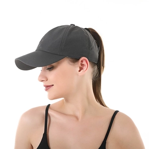 Detail of dark grey ponytail baseball cap showing rear opening and breathable mesh holes