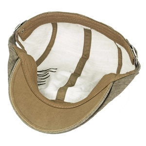 Detail view of cotton beret showing white lining, stitching and 100% cotton tag