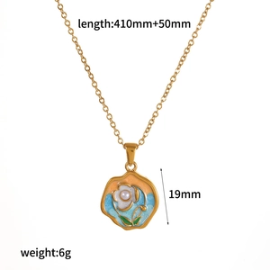 Detailed view of enamel flower pendant necklace with dimensions and white pearl center