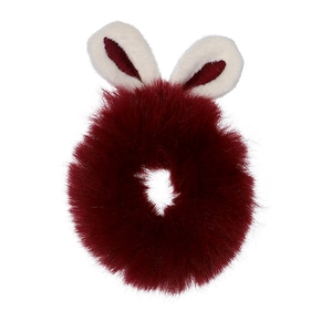 Detailed view of a dark red plush scrunchie with cute white faux fur bunny ears decoration