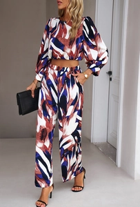 Detail of colorful abstract print on long sleeve crop top and wide-leg trousers set