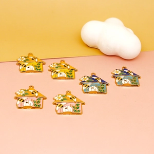 Detail view of six enamel house pendants in yellow, blue and pink alloy finishes