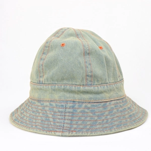 Close-up of light blue denim bucket hat with orange contrast stitching and vent details