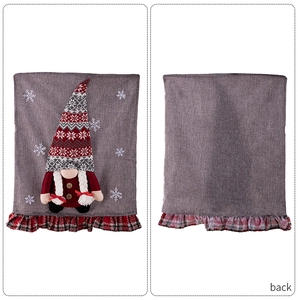 Detail view of gnome chair cover with 3D plush doll and snowflake embroidery decor