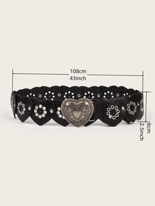 Detail of vintage heart-shaped PU leather belt with carved metal buckle and studs