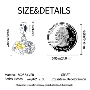 Detailed view of S925 sterling silver Christmas envelope charm with size comparison coin