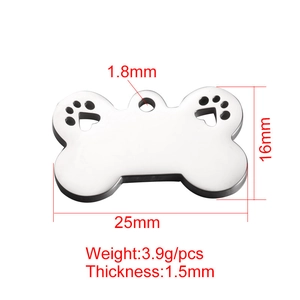 Detail view of 25x16mm bone shaped stainless steel dog tag with hollow paw prints