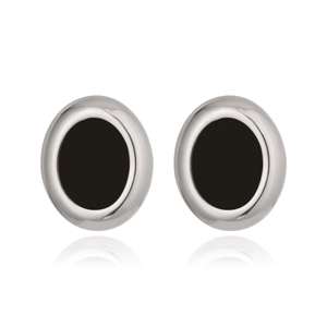 Macro detail of silver oval stud earrings with black enamel center inlay on white background