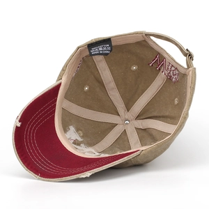 Detailed view of 100% cotton washed fabric cap interior with sweatband and embroidery