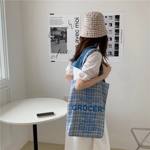 Blue checkered canvas tote bag with GROCERY print and matching bucket hat for women
