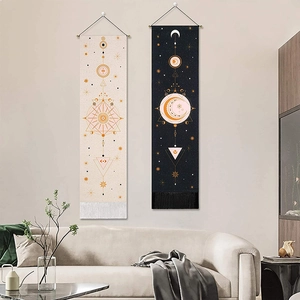 Bohemian moon phase wall tapestries in beige and black with decorative tassels