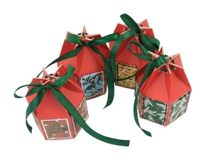 Christmas star-top candy boxes in red with green ribbons and festive holiday prints