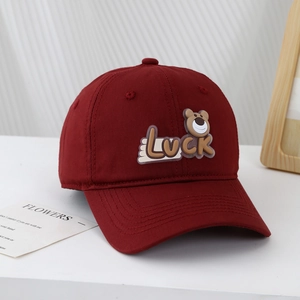 Maroon cotton baseball cap for kids with Luck bear patch and stitched curved brim