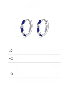 Detail of 925 sterling silver earring with blue enamel and white zircon inlay