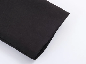 Detailed macro view of black elegant blazer fabric texture and professional seam stitching
