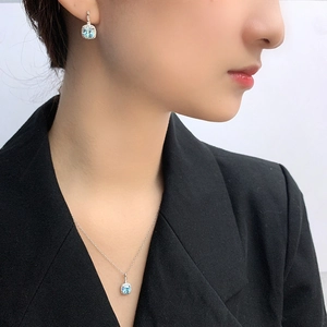 S925 silver ocean heart jewelry set featuring blue square gemstones on a female model
