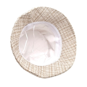 Detail of tweed bucket hat inner lining with adjustable drawstrings and soft sweatband