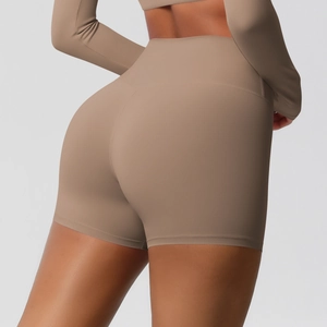 Macro shot of high-waisted seamless yoga shorts showing squat-proof matte fabric texture