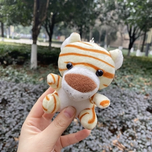 Cute plush tiger keychain with soft white fur and orange stripes for backpack decor