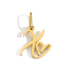 Macro shot of gold-tone heart-shaped letter X pendant charm with creative minimalist design