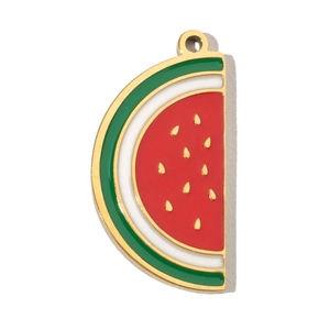 Detail of a watermelon charm with red enamel and golden trim for DIY jewelry