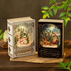 Vintage book-shaped Christmas lantern with Santa and Snowman inside LED snow globe