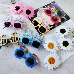 Funny daisy and birthday party sunglasses collection on a creative magazine background