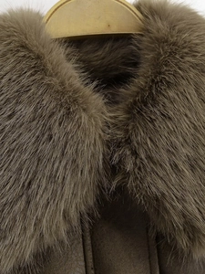 Detailed close-up of premium detachable faux fur collar on a winter bomber jacket
