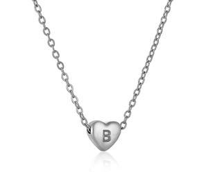 Macro detail of silver stainless steel heart pendant with engraved letter B on chain
