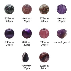 Detail view of colorful 8mm crackle glass beads and natural gravel for DIY jewelry making
