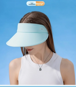 Macro detail of the light blue sun visor showing premium UV protection fabric and logo