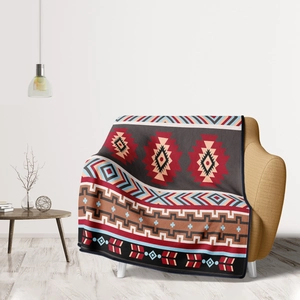 Bohemian flannel throw blanket with geometric diamond patterns draped on a cozy sofa