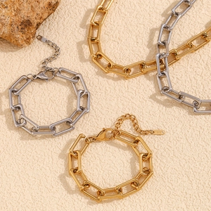 Detail of 18K gold and silver paperclip link chain with lobster clasp and extension