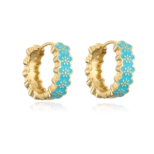Close-up of gold-plated hoop earrings with blue enamel flowers and intricate details