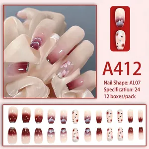 Press-on nail kit with burgundy gradient, cherry blossom motifs and silver glitter