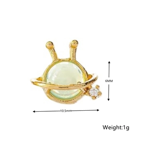 Detail view of 925 sterling silver alien stud earring with green gem and white stone