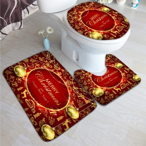 Three-piece Christmas bathroom set with red and gold plush mats and festive lettering