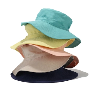 Vertical stack of colorful breathable cotton sun hats for children in various summer shades